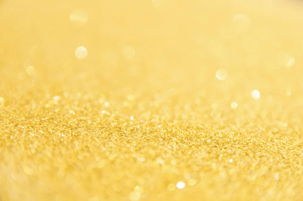 Rozostřené zlaté třpytky pozadí. Gold abstraktní bokeh backgroun — Stock fotografie