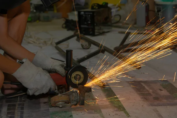 Electric wheel grinding cuting on steel. sparks from cutting — Stock Photo, Image