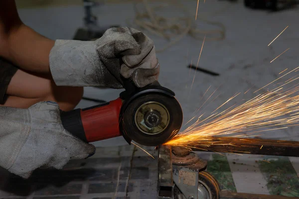 Electric wheel grinding cuting on steel. sparks from cutting — Stock Photo, Image