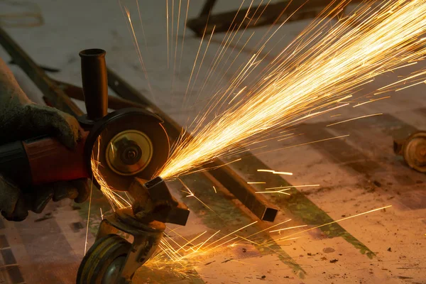 Electric wheel grinding cuting on steel. sparks from cutting — Stock Photo, Image