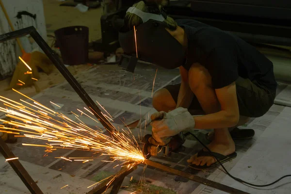 Electric wheel grinding cuting on steel. sparks from cutting — Stock Photo, Image