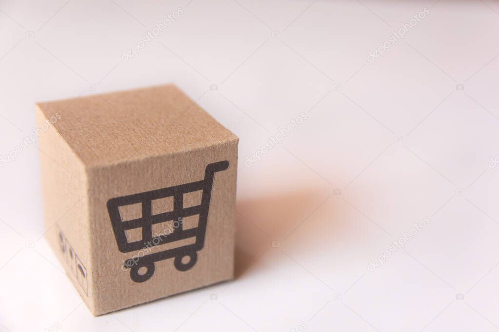 Cardboard box or parcel with supermarket cart logo on white back