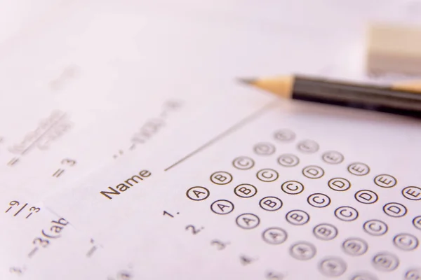 Pencil and eraser on answer sheets or Standardized test form wit — Stock Photo, Image