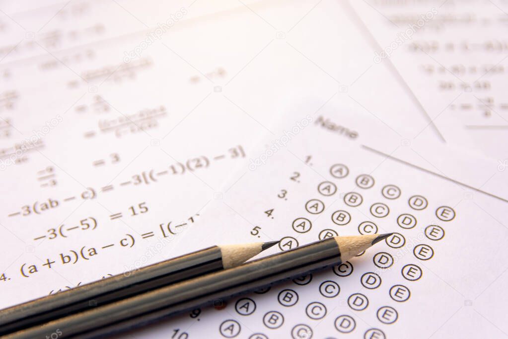 Pencil on answer sheets or Standardized test form with answers b