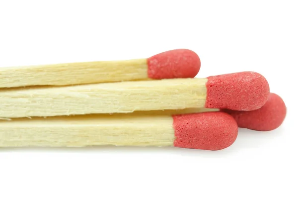 Close-up červená shoda izolované na bílém pozadí s výstřižkem — Stock fotografie