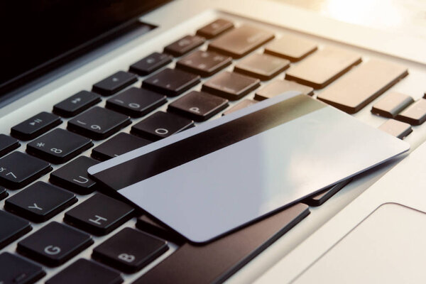 Credit card on laptop. Online payment concept