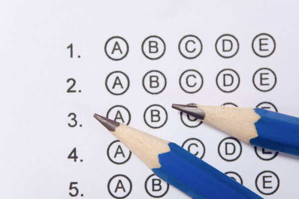 Pencil on answer sheets or Standardized test form with answers b