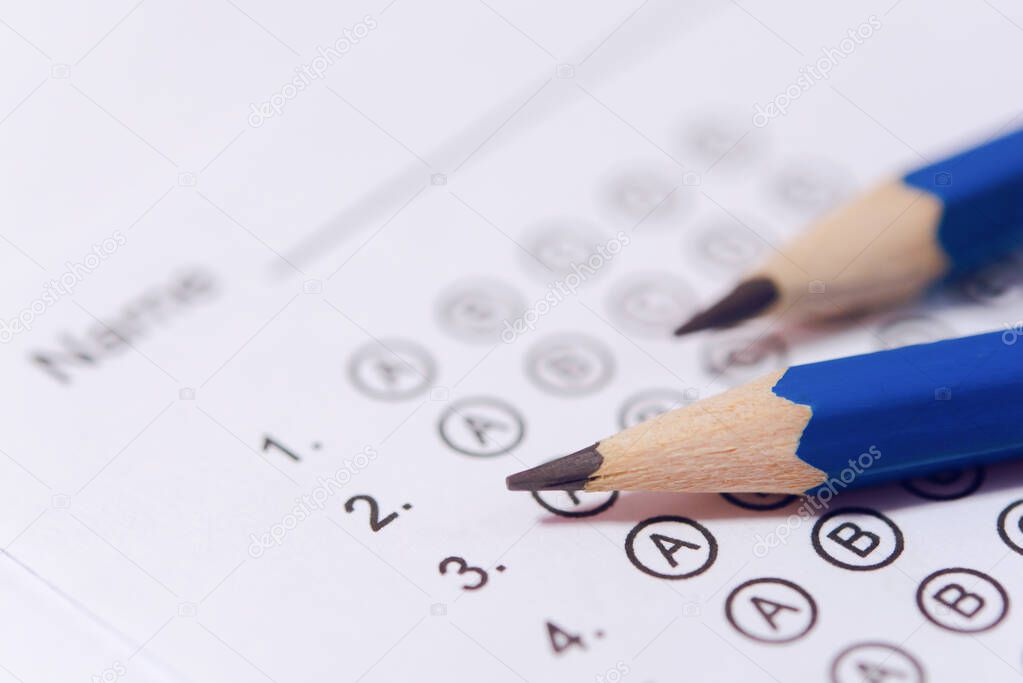 Pencil on answer sheets or Standardized test form with answers b