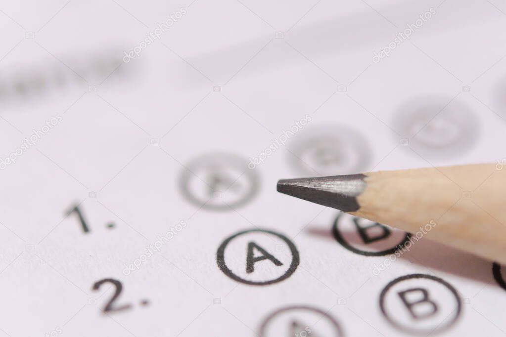 Pencil on answer sheets or Standardized test form with answers b