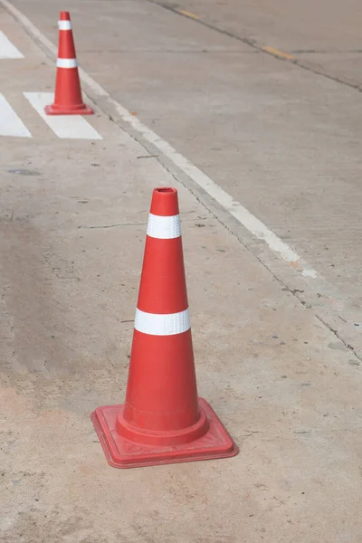 orange traffic cone in the road