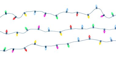 Noel ışıkları beyaz arka planda izole edilmiş bir şekilde kırpıştırılıyor