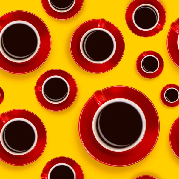 Seamless pattern with red coffee cups and a saucer on a yellow background — Stock Photo, Image