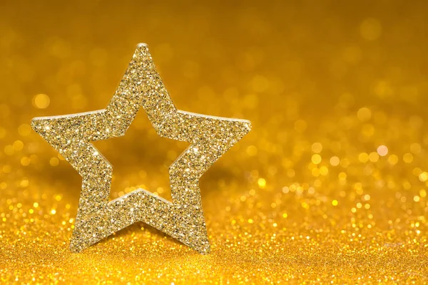 Shining star on a golden radiant background. Glitter shine with 3d shape