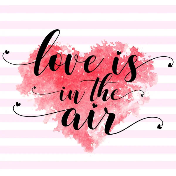 Röd vattenfärg hjärta och text kärlek är i luften på en strippad rosa vit — Stockfoto