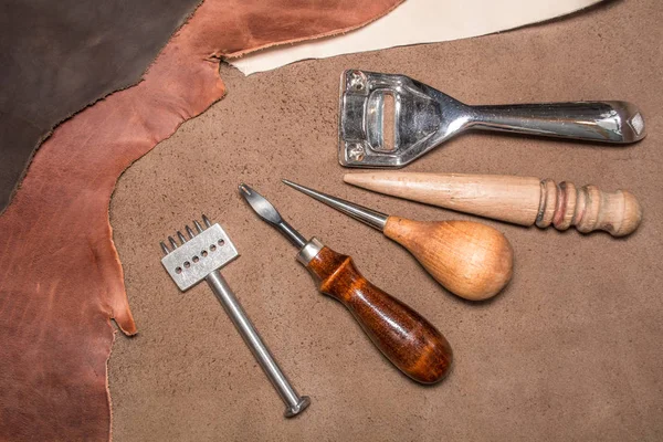 Natural leather and tools for creating products. View from above. — Stock Photo, Image