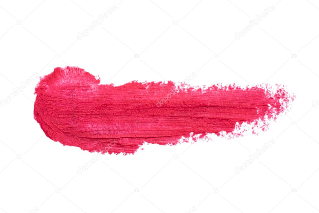 Red lipstick smudge isolated on white background. Smudged makeup product sample