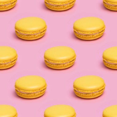 Seamless pattern with yellow macaron cookies on a pink background clipart