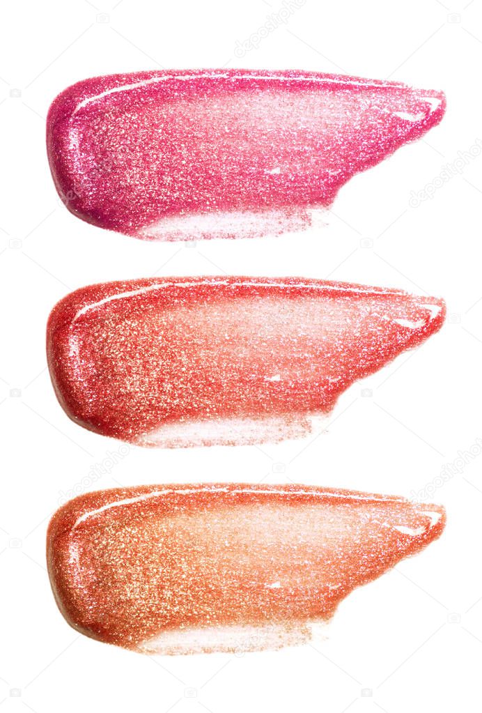 Set of different colors lip glosses smear isolated on white