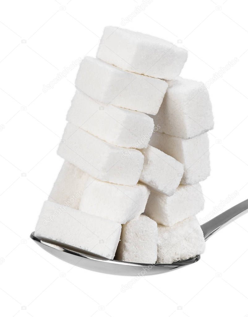 Too much sugar cubes in a spoon on white background. Insane sugar addiction and unhealthy nutrition concept.