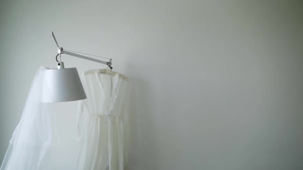 Bridal boudoir sexy dress and veil on lamp — Stock Video