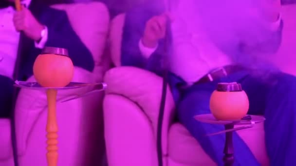 Hookah on orange fruit. — Stock Video