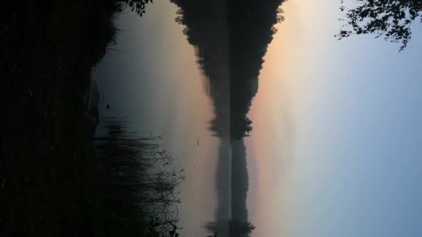 Vertical video. Sunrise or sunset at lake — Stock Video