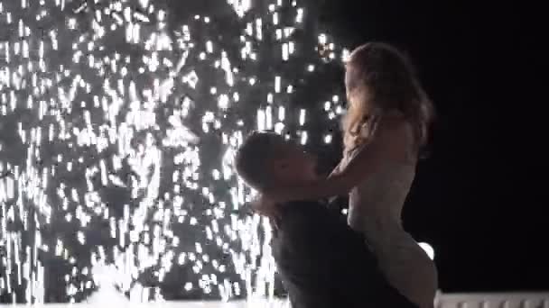 Firework fountains at the end of the wedding. People have fun, dance and hugging together — Stock Video