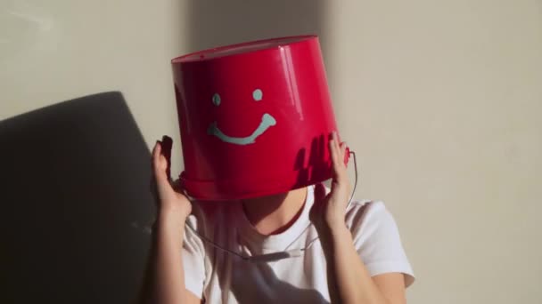 Worker in uniform with red bucket on his head have fun — Stock Video