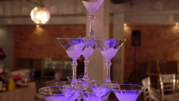 Pyramid tower of glasses for champagne at the party in restaurant — Stock Video