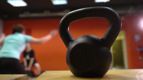 Young people working out their arms using in a cross-training gym — Stock Video