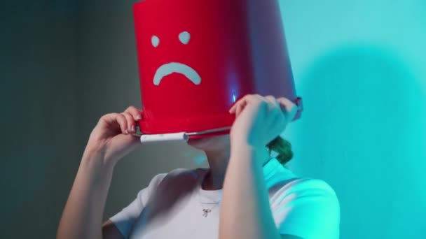 Worker in uniform with red bucket on his head sad — Stock Video