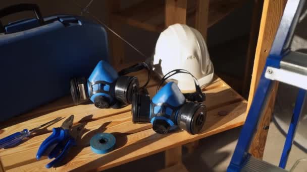 Work tools - toolbox with instruments, helmet, protective mask, pliers, tape and screwdriver — Stock Video