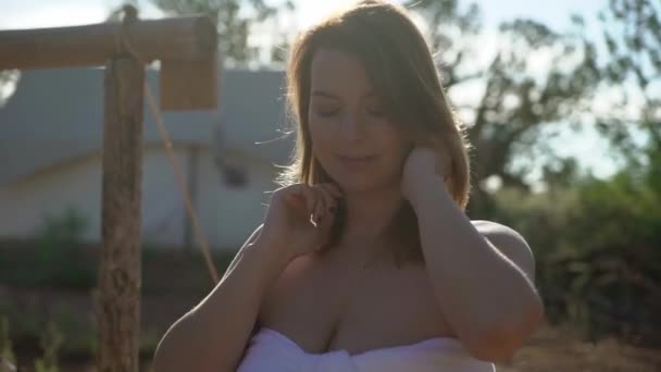 Young woman in towel near tent — Stock video