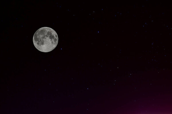 Crescent moon in the starry night sky