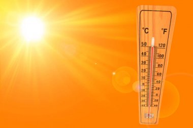Sunny summer background with the thermometer marking a temperature over 50 degrees and bright sun on an orange background clipart