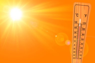 Sunny summer background with the thermometer marking a temperature over 40 degrees and bright sun on an orange background clipart