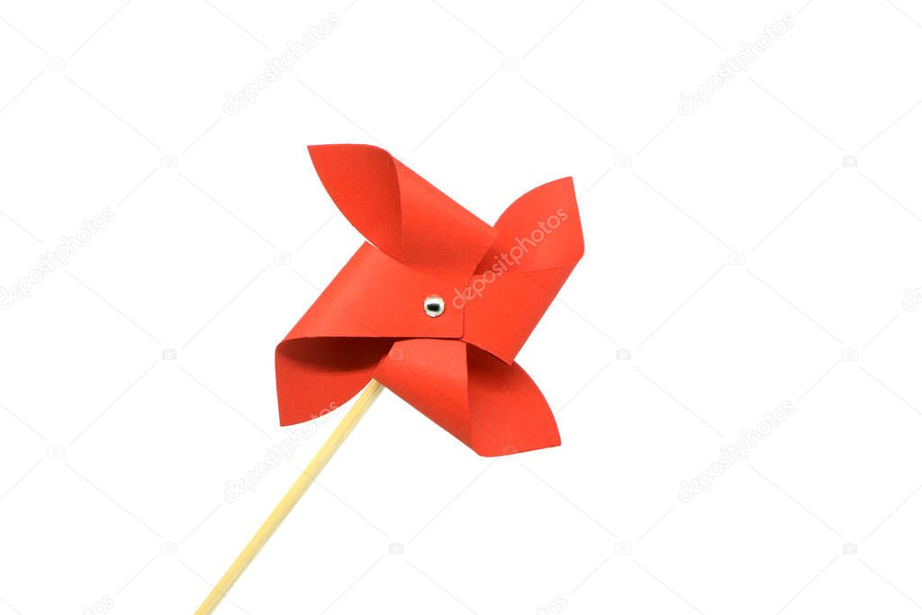 Red pinwheel on a white background.Toy for child.