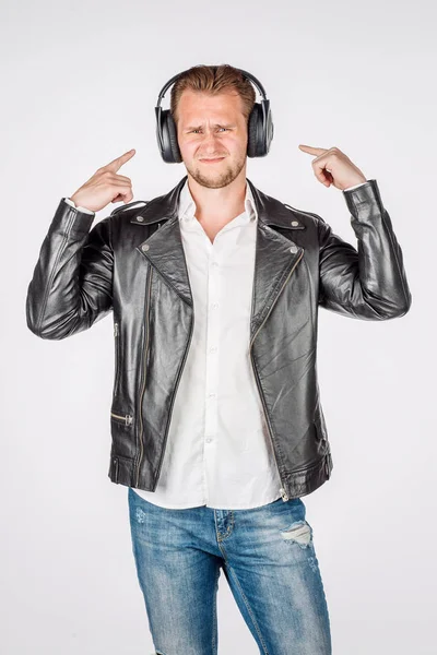 Portrait of young man in black eather jacket isolated on a white — Stock Photo, Image