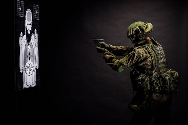 Modern russian special forces soldier with rifle on dark background. army, military and people concept