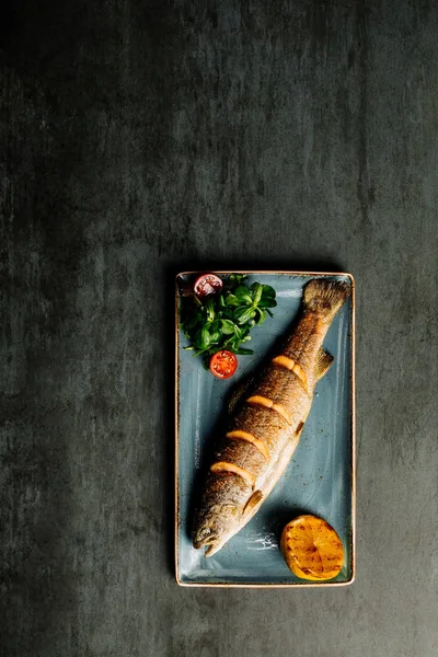 Grilled trout on blue plate. menu concept. — Zdjęcie stockowe