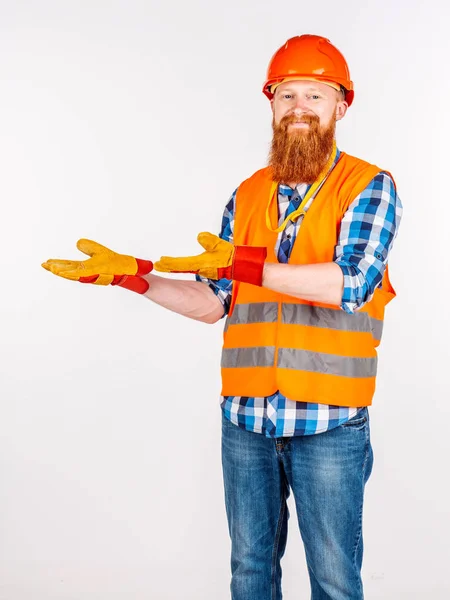 Male builder  with helmet over white wall background. repair, co — Stock Photo, Image