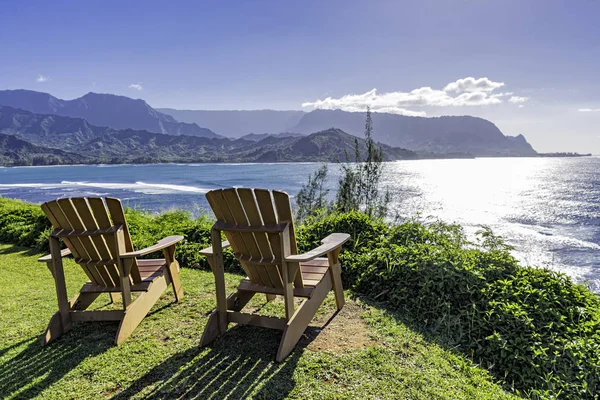 Lounging chairs overlooking Hanalei Bay and the Na Pali coast Princeville Kauai Hawaii USA — Stock Photo, Image