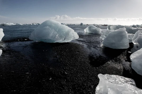 Diamond Beach Iceland. Ice on the black beach near Jokulsarlon glacier lagoon. Glacier icebergs in Iceland. Icelandic Nature.