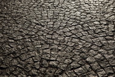 Porfir küpleri ile döşeli şehir. Arnavut kaldırımlı doku. Bir sokak taş döşeme ile katında. Granit cobblestoned kaldırım arka plan.