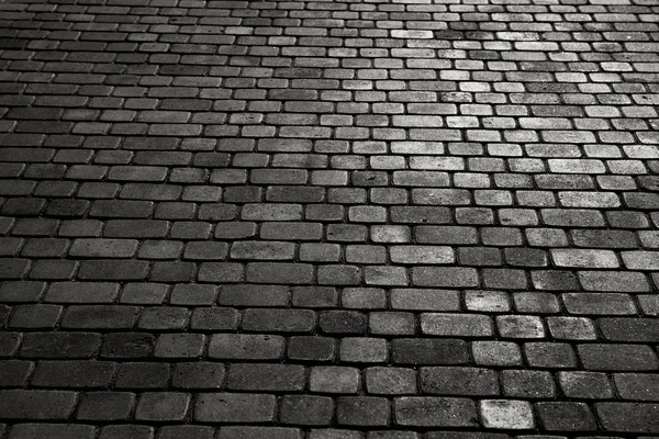 被结合的城市与斑岩立方体 鹅卵石的纹理 一条有石砖的街道的地板 花岗岩鹅卵石铺装路面背景 — 图库照片