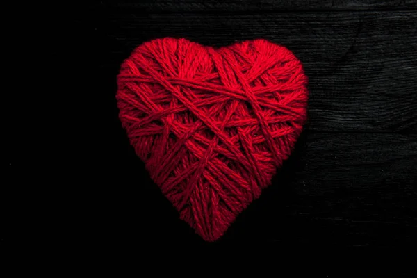 Valentines day. Valentines day greeting card. Heart on a wooden background. Heart of love