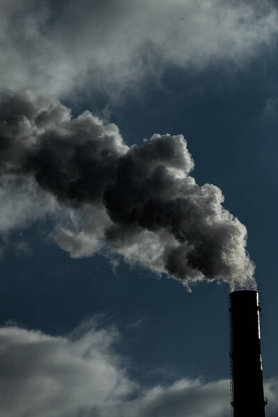 Air pollution. Harmful emissions. Bad ecology. Smoke from factory pipeDirty smoke on the sky, ecology problems