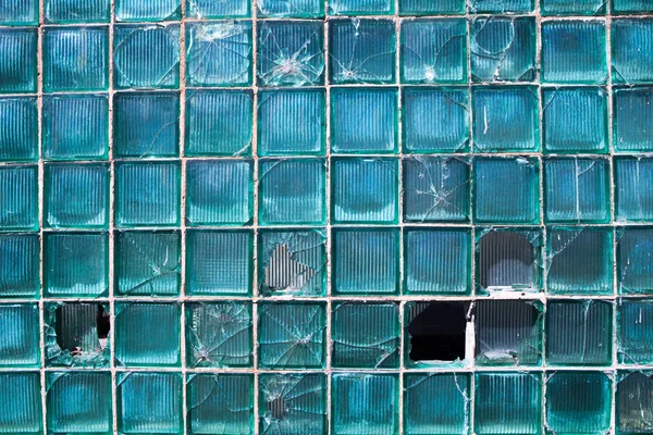 Broken glass for background pattern. Broken window with a bullet hole in the middleHole in the window. Crash texture