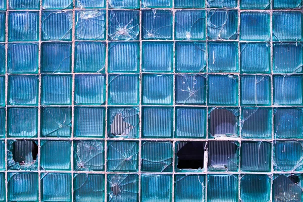 Broken glass for background pattern. Broken window with a bullet hole in the middleHole in the window. Crash texture