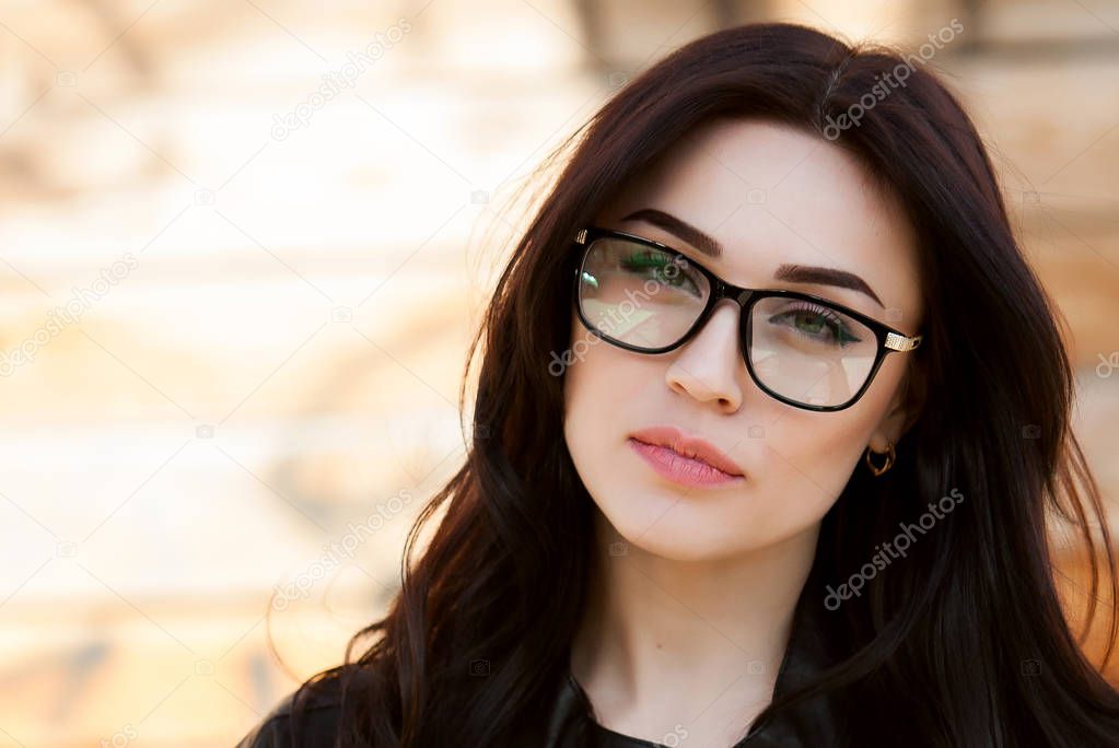 Portrait of smart, clever girl in glasses. Beautiful European girl with glasses. Beauty sexy fashion model woman portrait wearing glasses